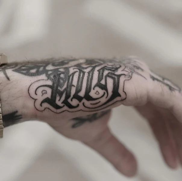 Lettering Lettering tattoo on Back of Hand