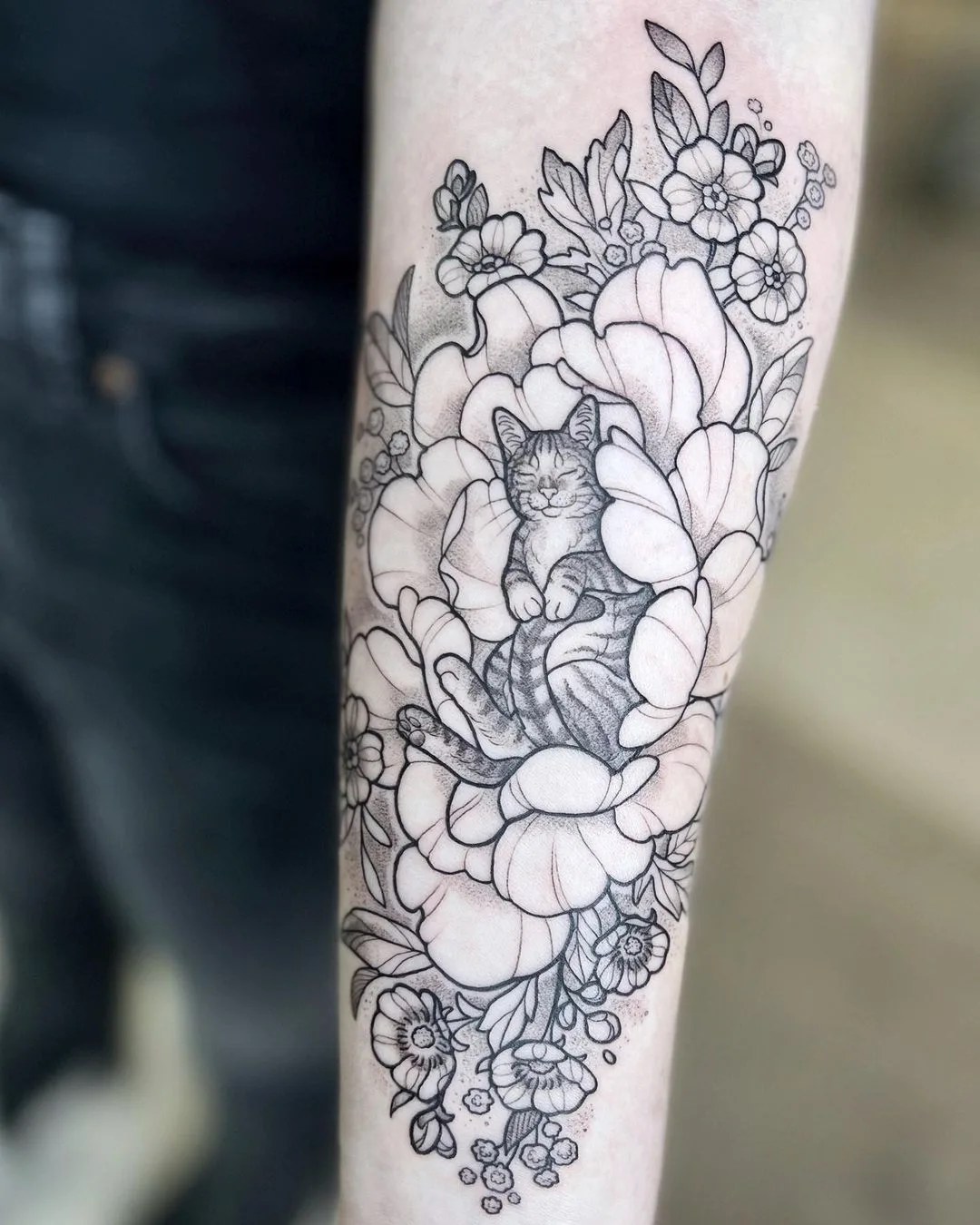 a cat in a flower graphics tattoo by @lordenstein_art