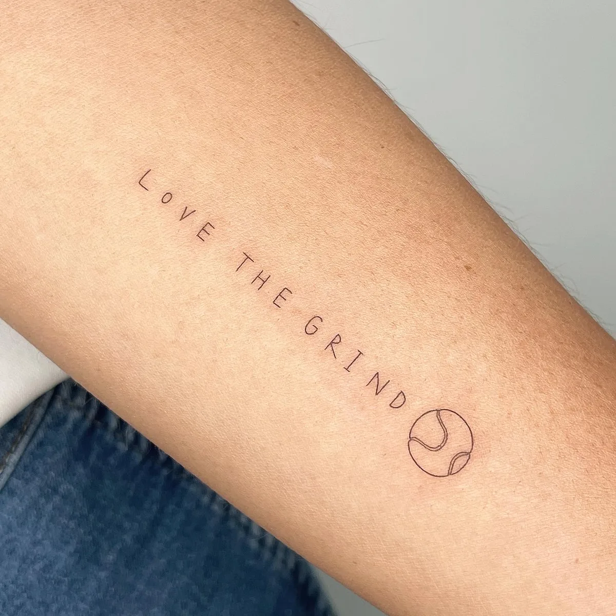 Thin lettering tattoo by Sop Tattoo