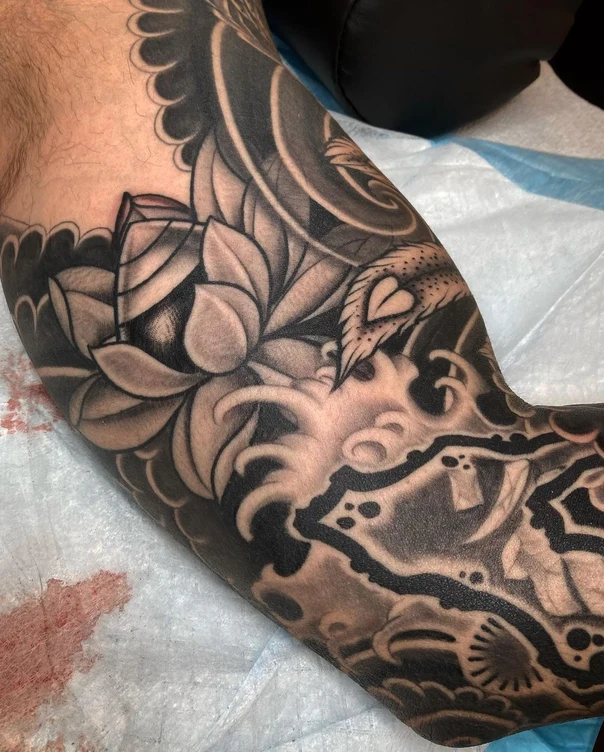 Blackwork Lotus, Waves tattoo on Forearm
