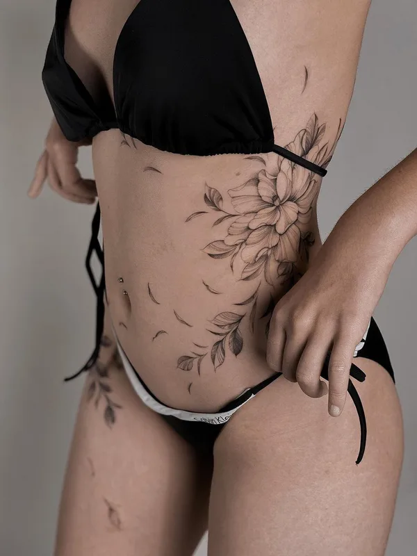 female black botanic, fineline tattoo on side, stomach #57857 | Tattoo Artist Nicazky