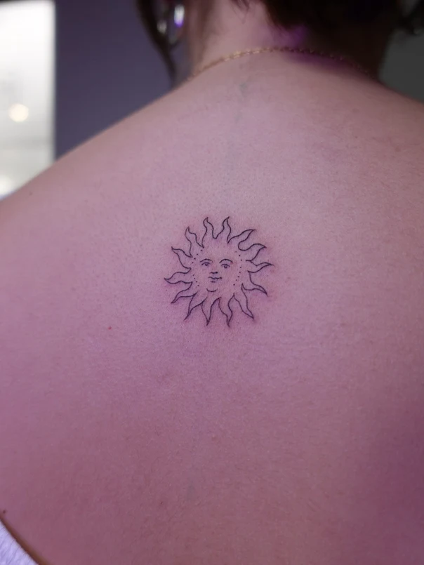 Linework Sun tattoo on Shoulder Blade