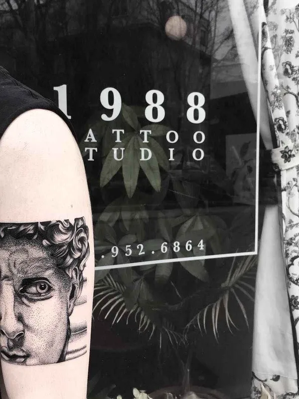 black and grey black and grey Tatuaggio su bicep #11961 | Tatuatore Olivier Casault