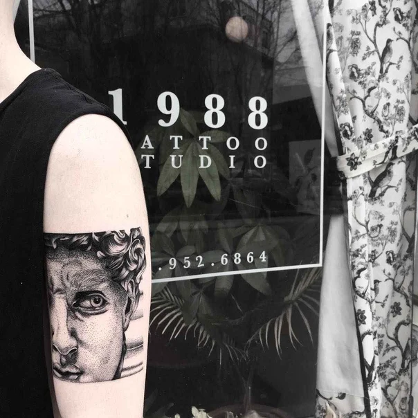 Black & Grey Portrait tattoo on Bicep
