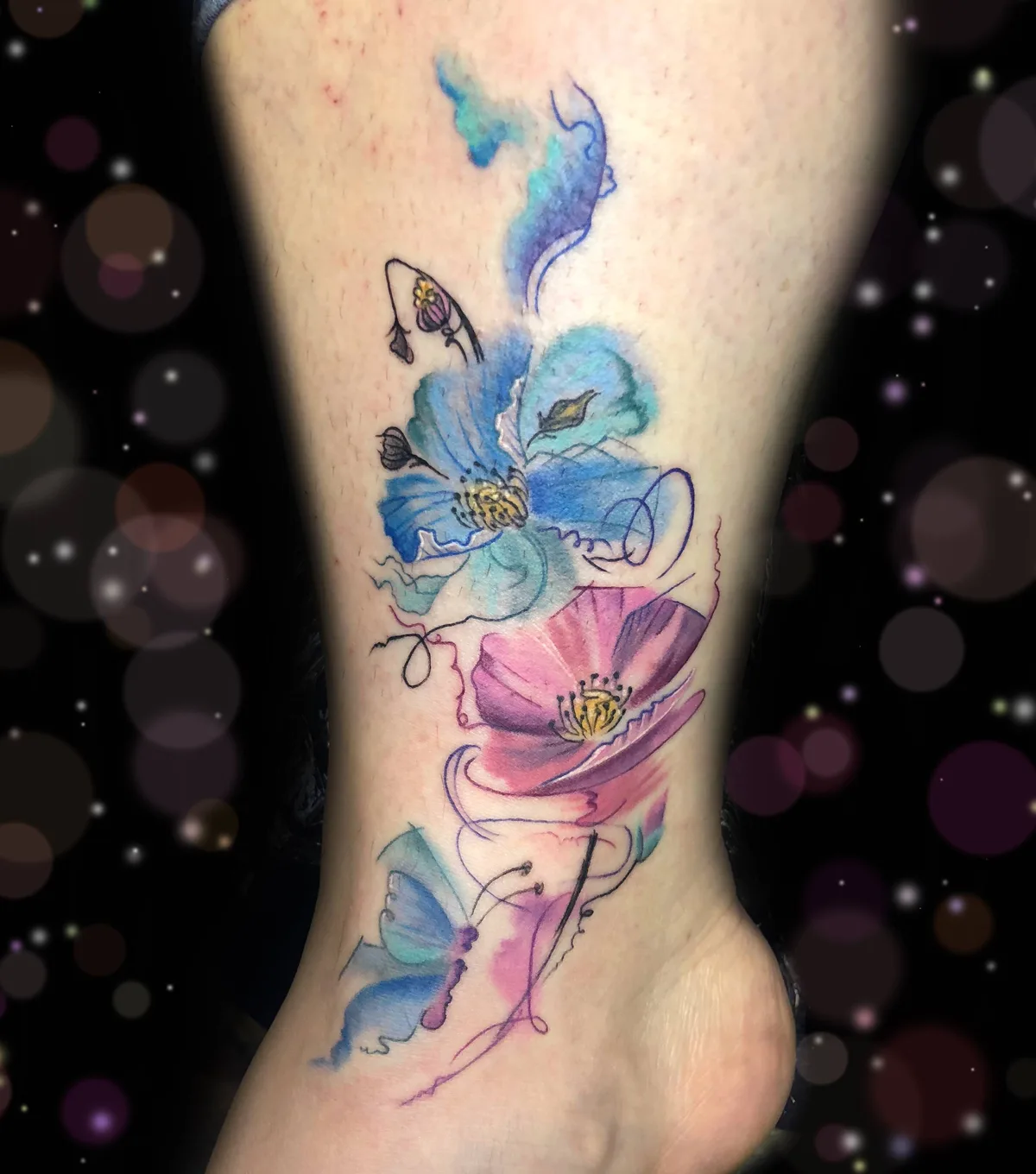 Tattoo artist Megan Wood, watercolor, realistic authors tattoo, flowers, animals | USA