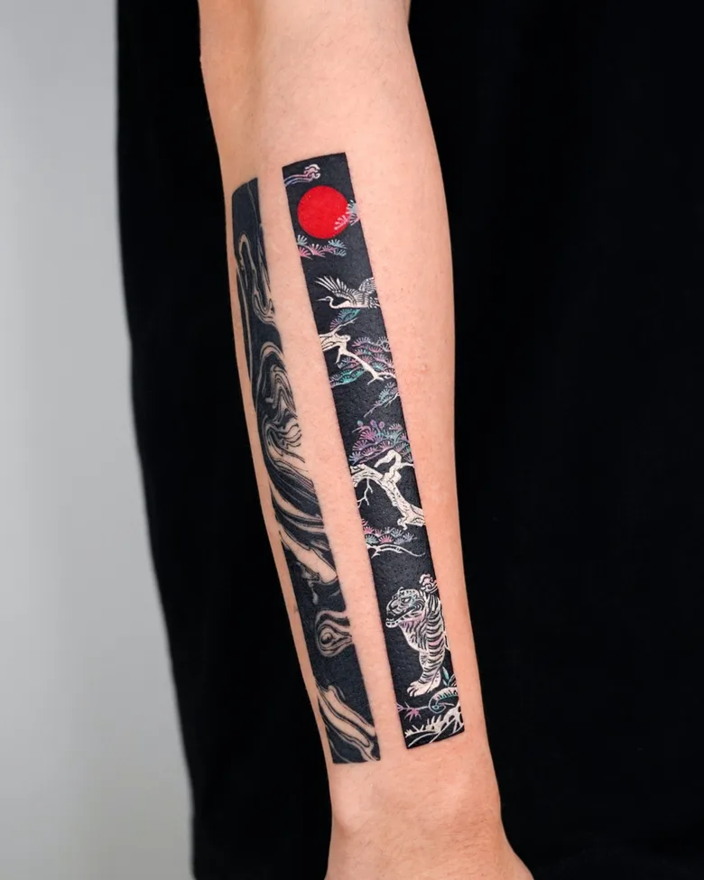 A two-panel vertical tattoo on a black background featuring a tiger, a crane, and a sun in a Japanese-inspired style.