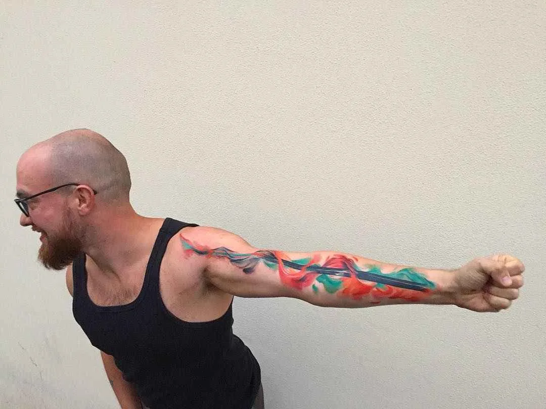 Tattoo artist Ondrej Konupcik, lightness abstract full arm watercolor tattoo