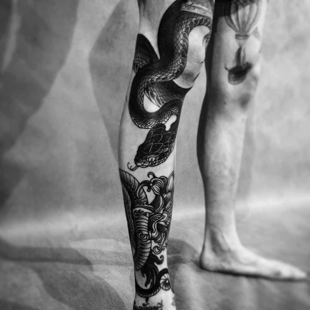 Blackwork Snake, Elephant tattoo on Calf