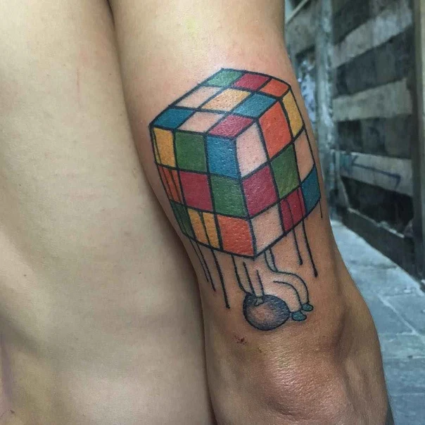 Geometric Rubik's cube tattoo on Forearm