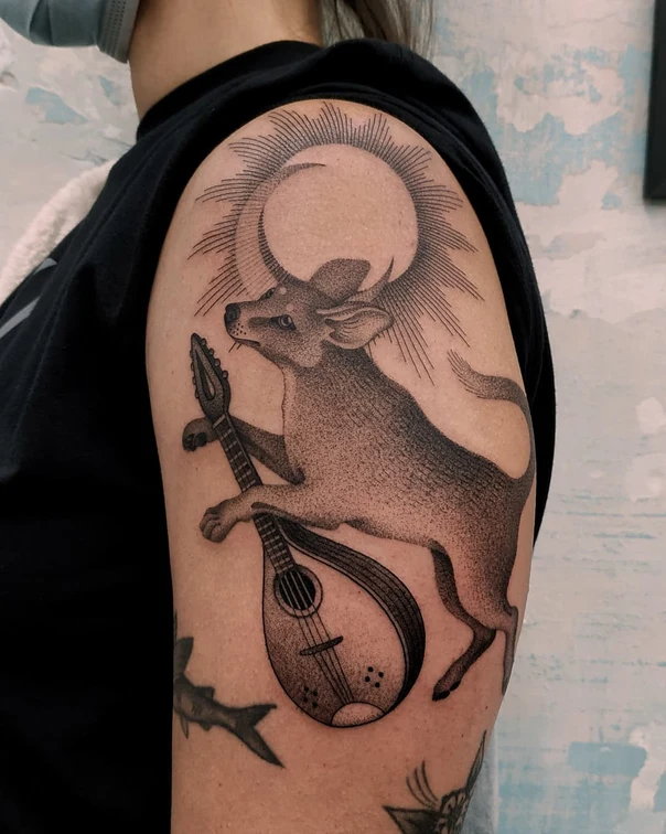 Blackwork Animal, Musical instrument tattoo on Shoulder