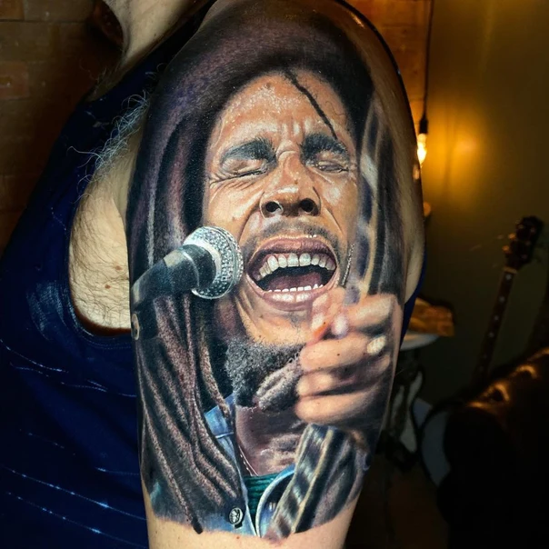 Realism Portrait, Microphone tattoo on Upper Arm