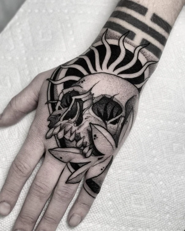 Blackwork Skull, Sun tattoo on Hand