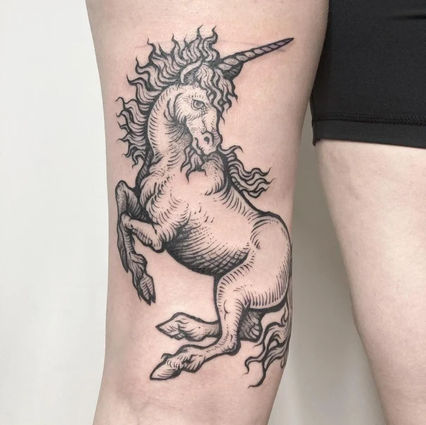 Engraving Unicorn tattoo on Thigh