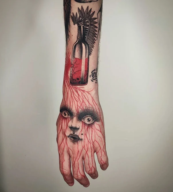 Illustrative Face, Bottle tattoo on Back of Hand