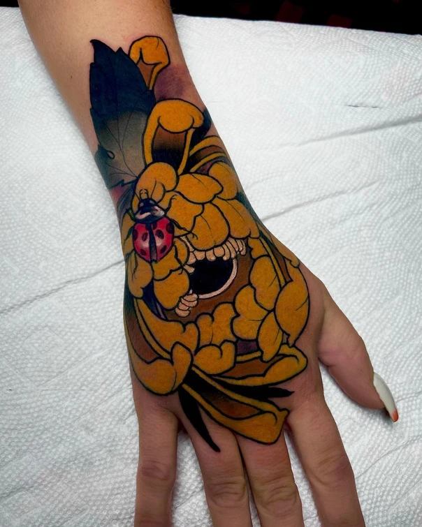 Japanese Flower, Ladybug tattoo on Back of Hand