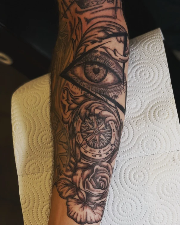 Black & Grey Eye, Compass tattoo on Forearm