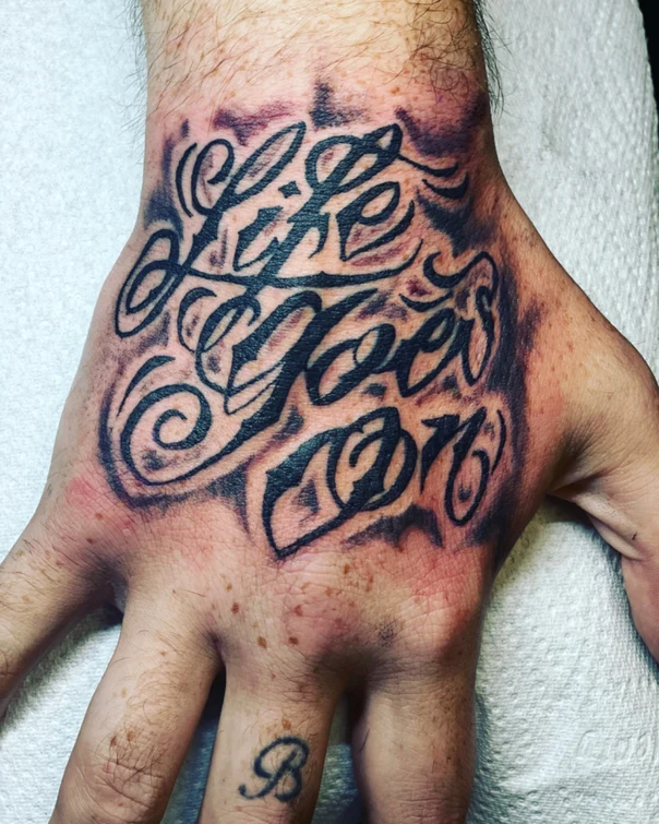 Lettering Text tattoo on Hand