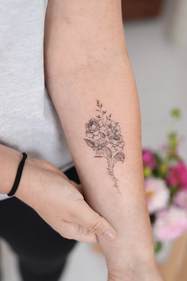 Fineline Flowers, Lettering tattoo on Forearm