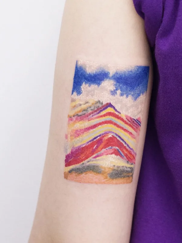color watercolor tatuaje en upper arm #74147 | Tatuador @dareumtattoo