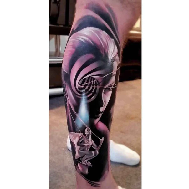 Surrealism Face, Abstract tattoo on Calf