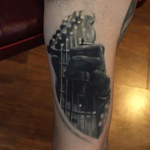Realism Guitar, Hand tattoo on Thigh