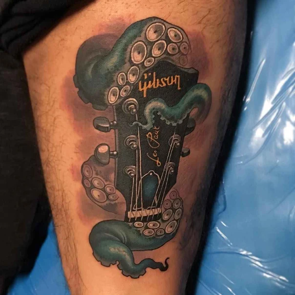 Illustrative Octopus, Guitar tattoo on Thigh