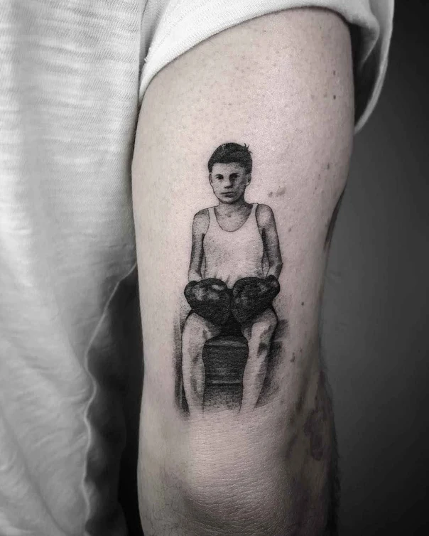Realism Child, Boxing gloves tattoo on Bicep