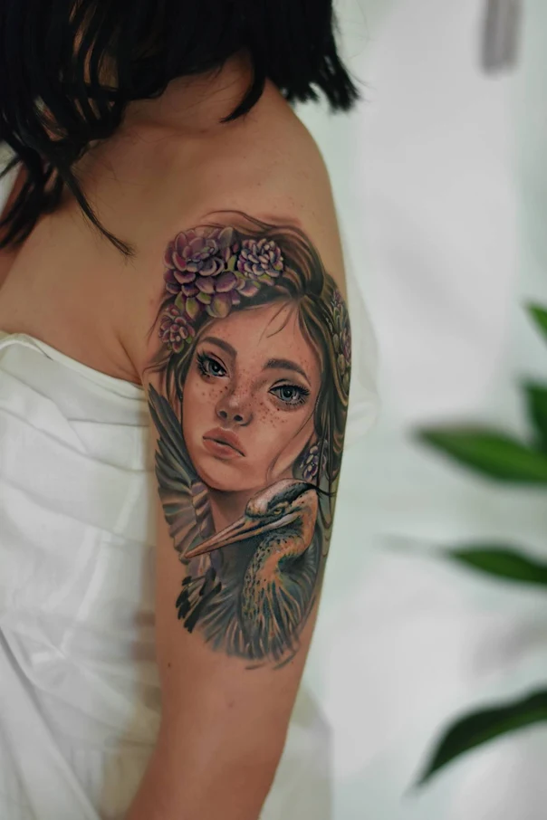 Realism Portrait, Bird tattoo on Upper Arm