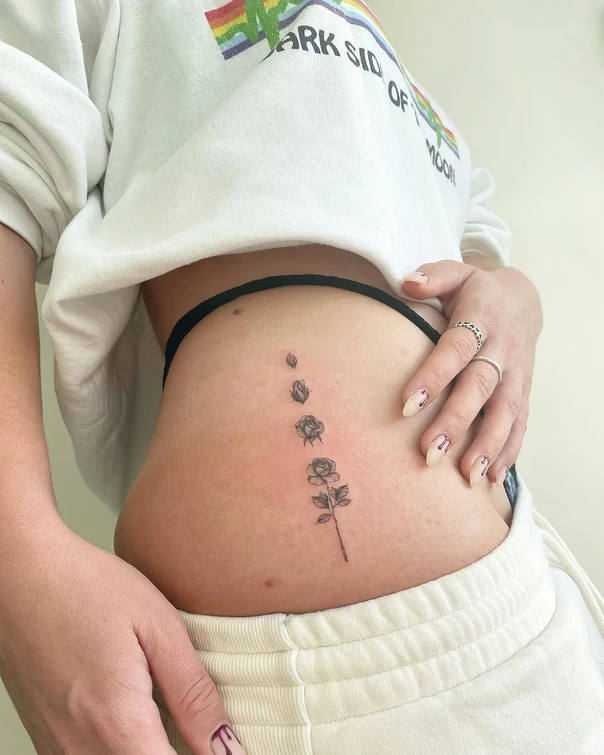 Fineline Rose, Floral tattoo on Stomach