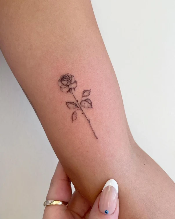 Fineline Rose tattoo on Forearm