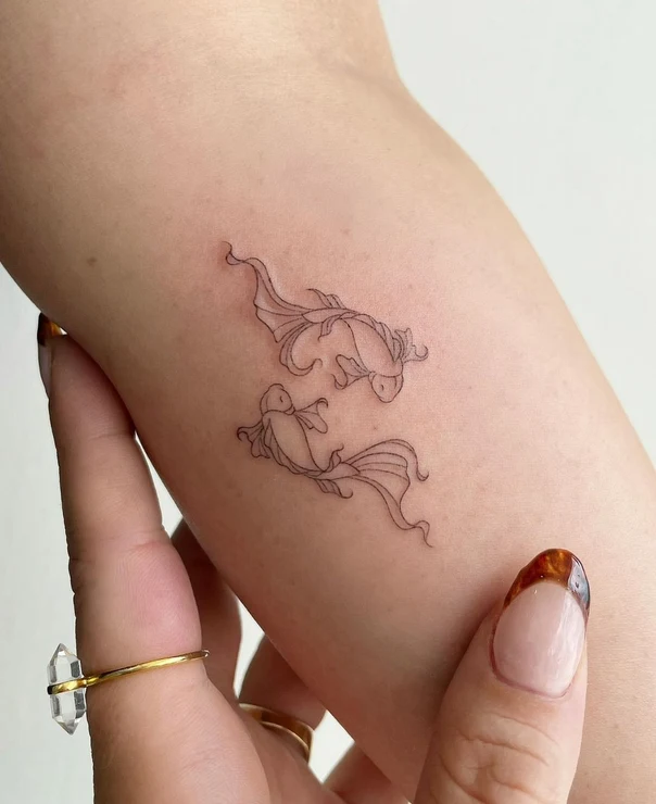 Fineline Fish tattoo on Forearm