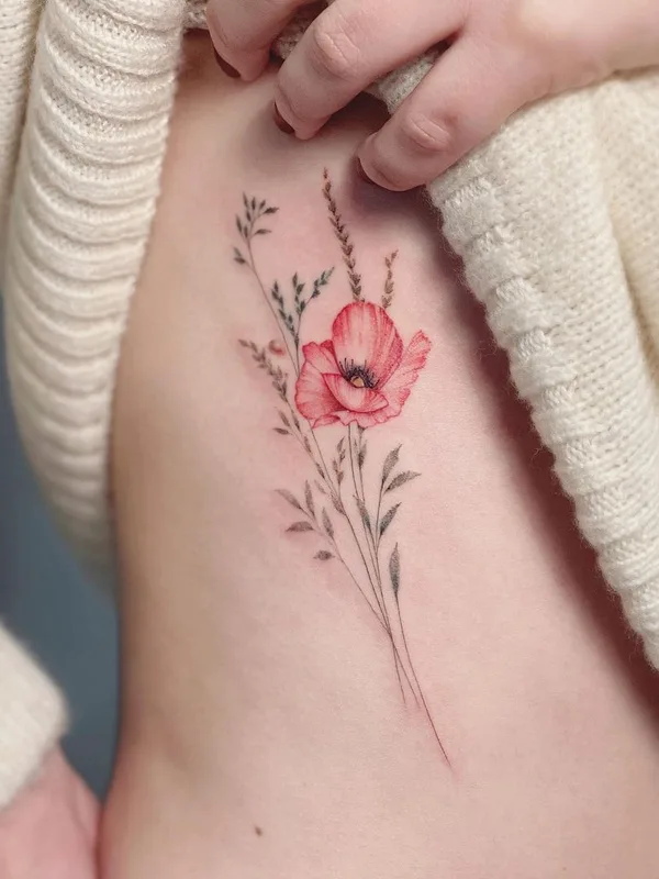 female color botanic Tatuaggio su ribcage #43232 | Tatuatore Eva Edelstein