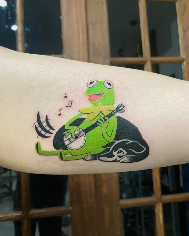 Cartoon Kermit the frog, Dog tattoo on Forearm