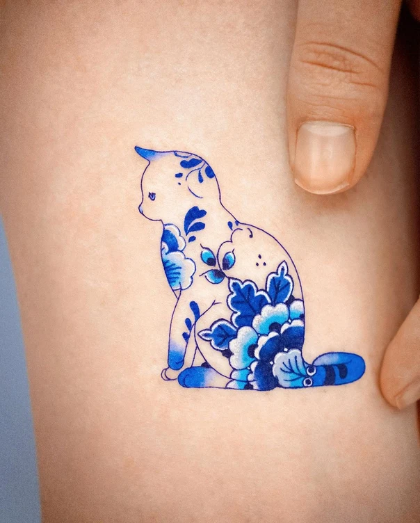 Illustrative Cat, Floral tattoo on Thigh