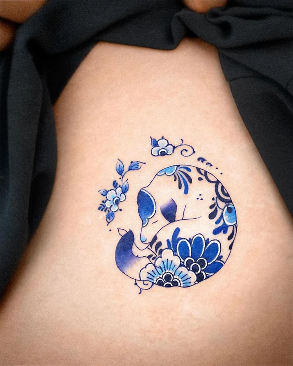 Illustrative Fox, Flowers tattoo on Side