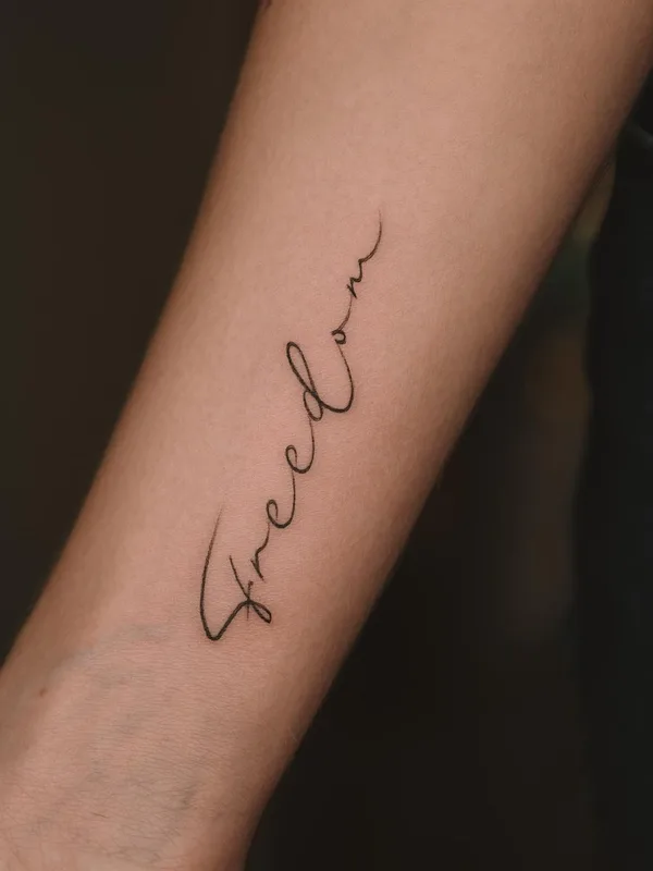 black calligraphy Tatuaggio su forearm #59448 | Tatuatore Charina Muratova