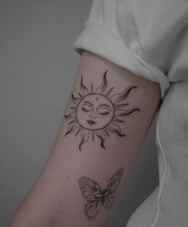 Illustrative Sun with face, Butterfly tattoo on Forearm