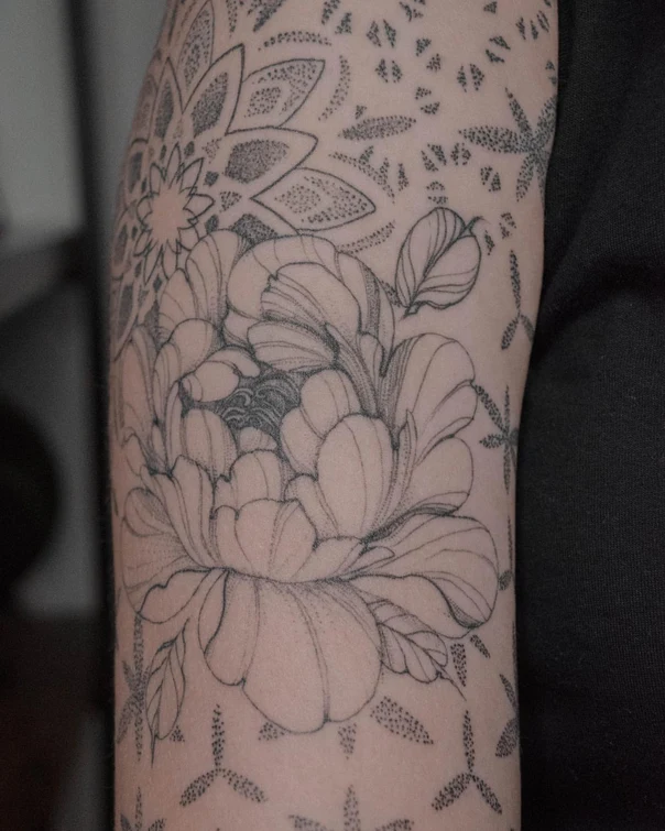 Traditional Flowers, Leaves tattoo on Upper Arm