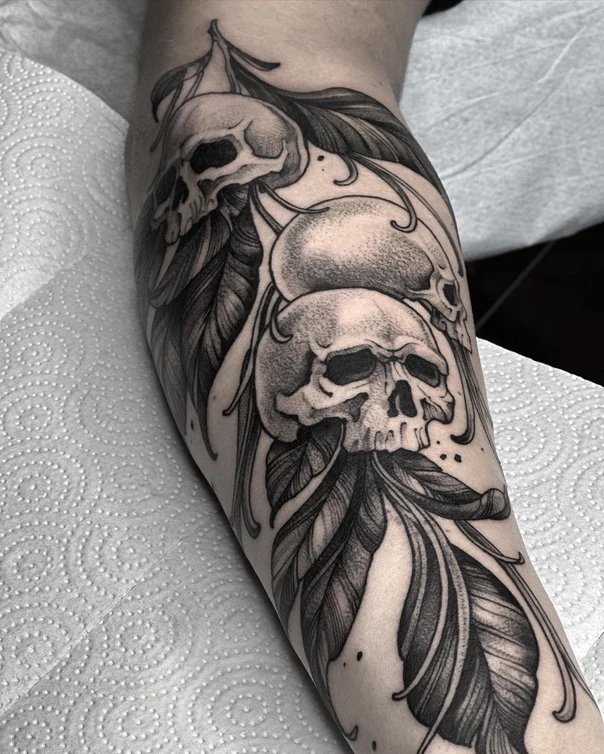 Black & Grey Skull, Feather tattoo on Forearm