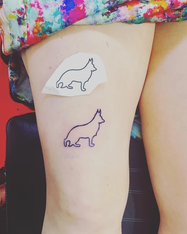Minimalist Dog tattoo on Thigh