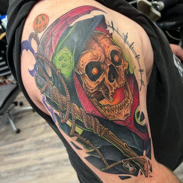Neo-traditional Skull with glowing eyes, Hood (red and green) tattoo on Upper Arm