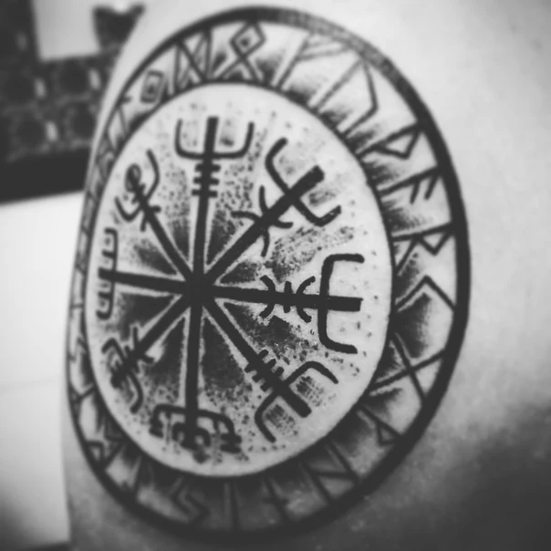 Geometric Circular design, Cross-like symbol tattoo on Upper Arm