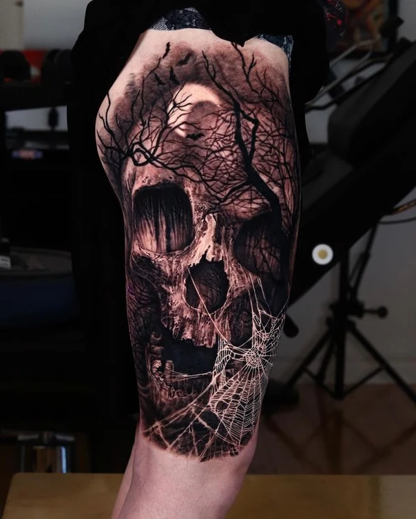 Black & Grey Skull, Tree tattoo on Thigh