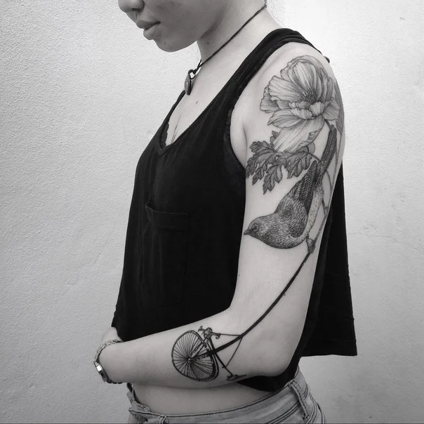 Blackwork Bird, Flower tattoo on Outer arm