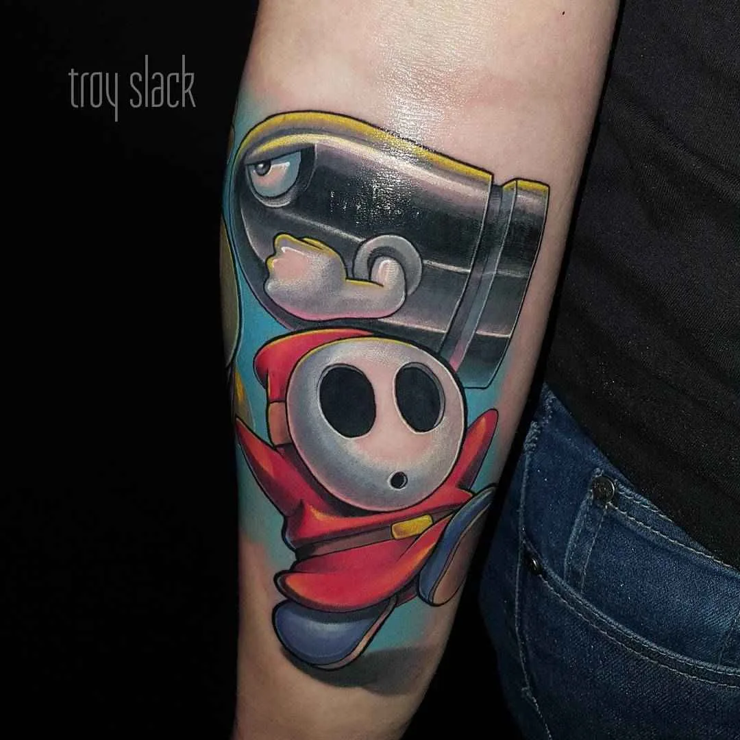 Artista de tattoo Troy Slack tattoo colorida da escola nova, personagens de quadrinhos e desenhos animados 
