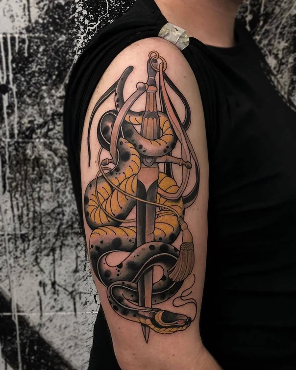 Neo Traditional Snake, Sword tattoo on Upper Arm
