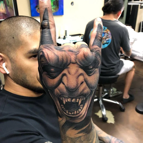 Realism Demon, Face tattoo on Hand