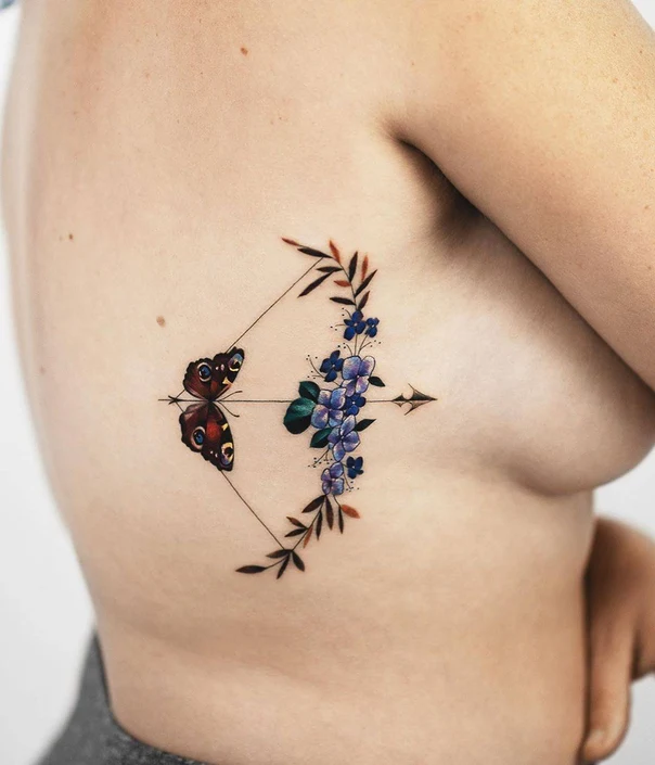 Illustrative Butterfly, Flowers tattoo on Ribcage