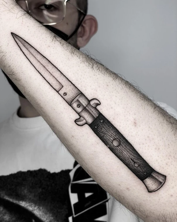 Blackwork Knife tattoo on Forearm