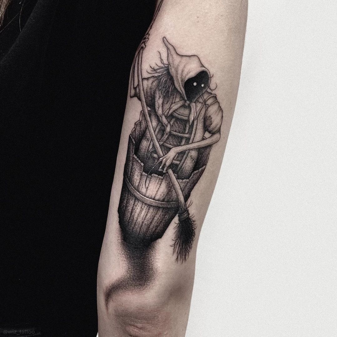 Baba Yaga tattoo located on the upper arm, engraving